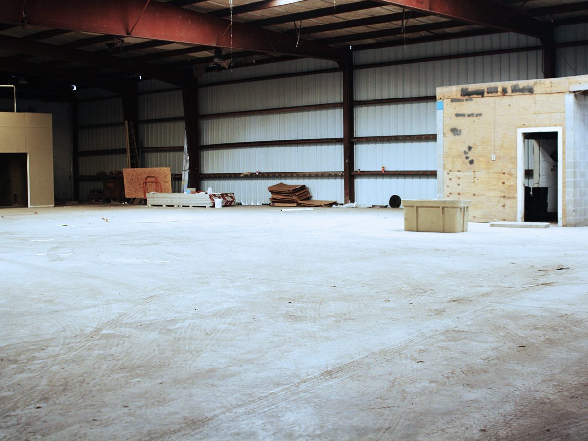A warehouse with boxes and other items in it.